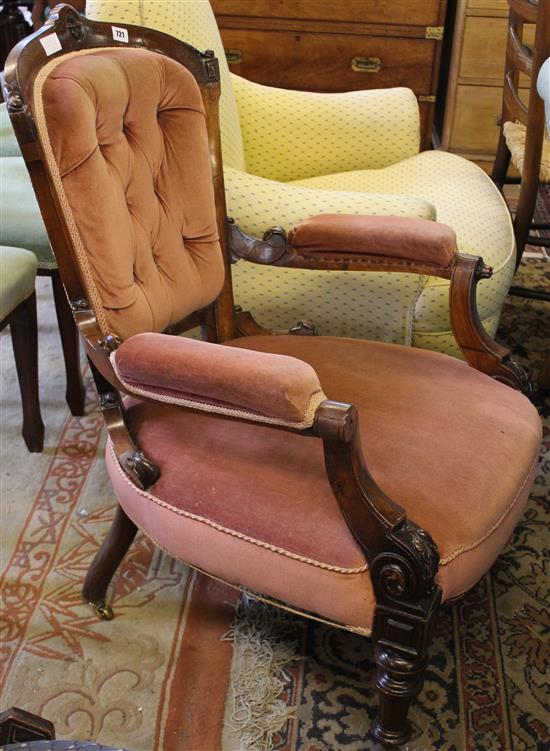 Victorian carved walnut open armchair, with pink velour buttoned upholstery